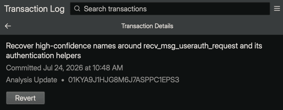 The transaction detail header showing the description headline, the committed state with timestamp, the Analysis Update type with the full transaction ID, and the Revert button